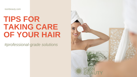  A woman in a robe gently brushes her hair, demonstrating effective hair care techniques for healthy locks.